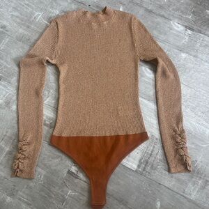 Free people  bodysuit. Very lightweight ribbed with metallic . New without tags